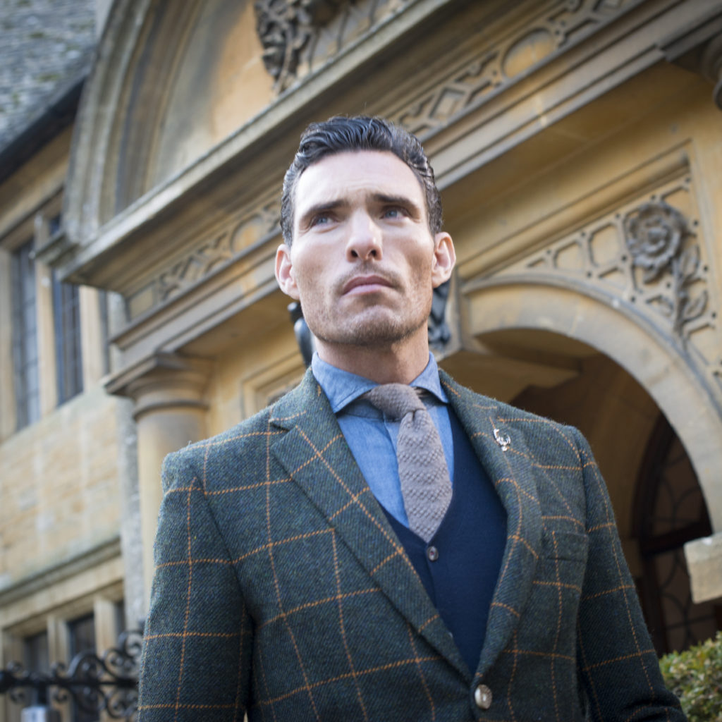 A model wearing a checked tailored suit from The Bespoke Tailor